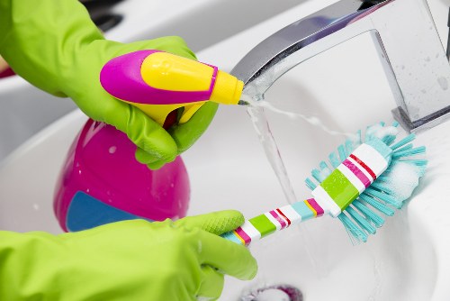 Experienced cleaner carefully maintaining delicate surfaces in Hampstead