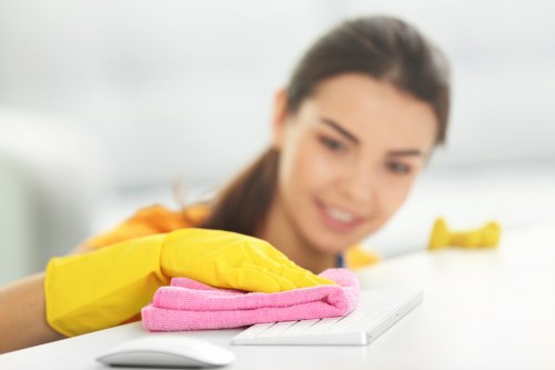 Staff member wearing PPE during a professional cleaning task