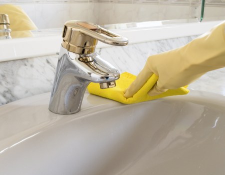 Protective gloves and cleaning products arranged safely for use